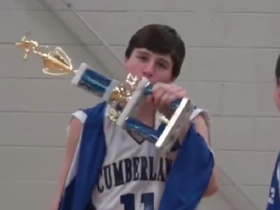 Tyler Kolek is kissing the trophy in the picture.